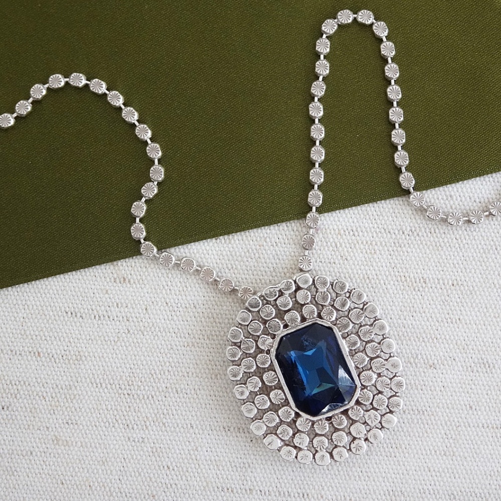 Large oval silver pendant with faceted blue sapphire crystal center. Glam, NWT